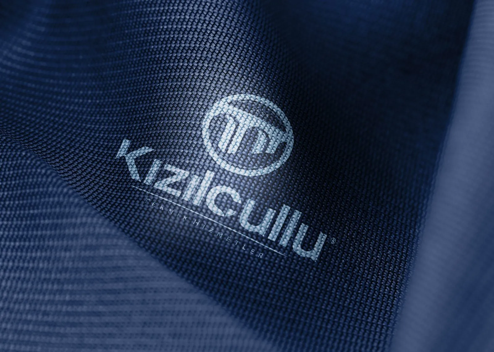 The Kızılçullu logo embroidered on navy fabric
