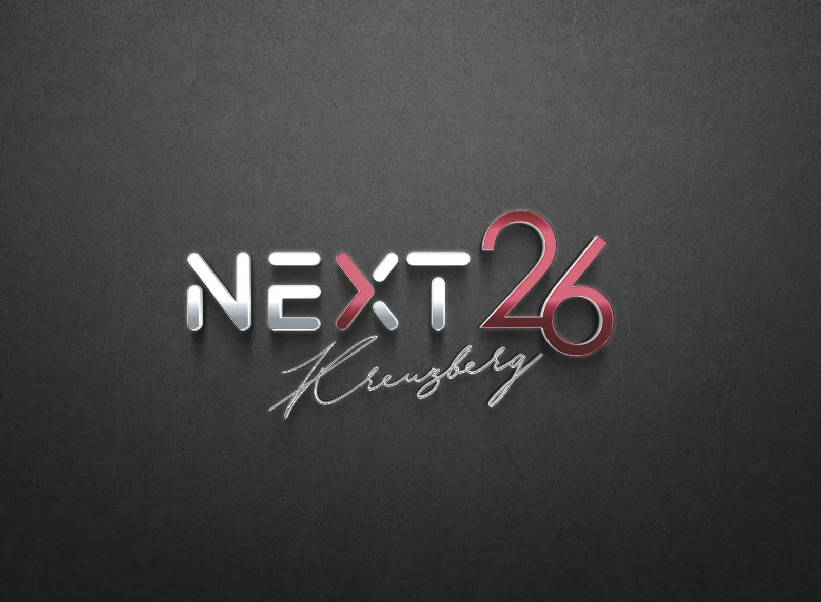 The chrome and red Next 26 Kreuzberg logo on a dark background